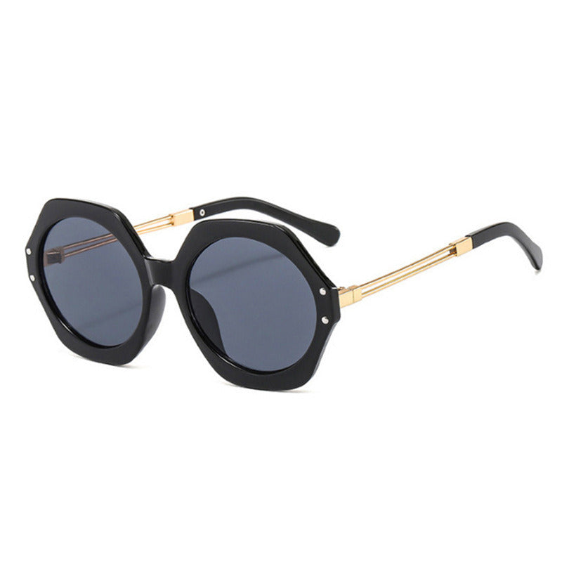 A pair of black, oversized hexagonal irregular sunglasses men's foreign trade geometric polygon sunglasses women's sunglasses with gold metal arms on a white background, featuring UV400 protection.