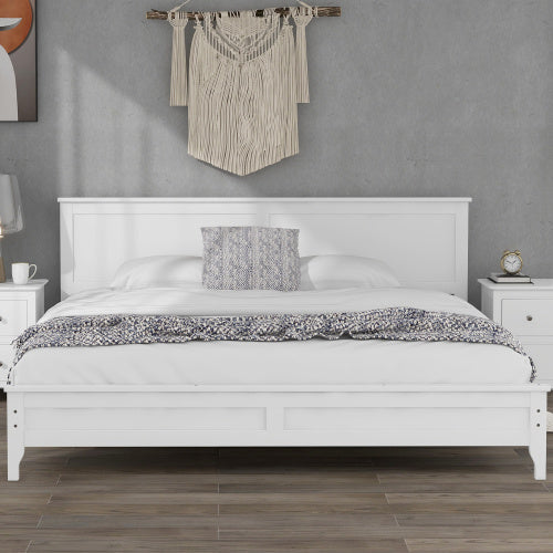 A Modern White Solid Wood King Platform Bed with a wooden headboard and footboard.