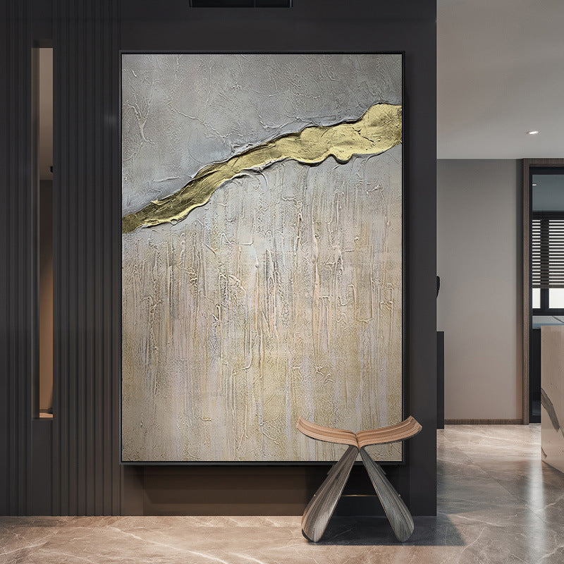 Large Hand Painted Texture Abstract Oil Painting Gold Foil in a modern interior, featuring a textured grey backdrop with a golden streak, accompanied by a small wooden stool.