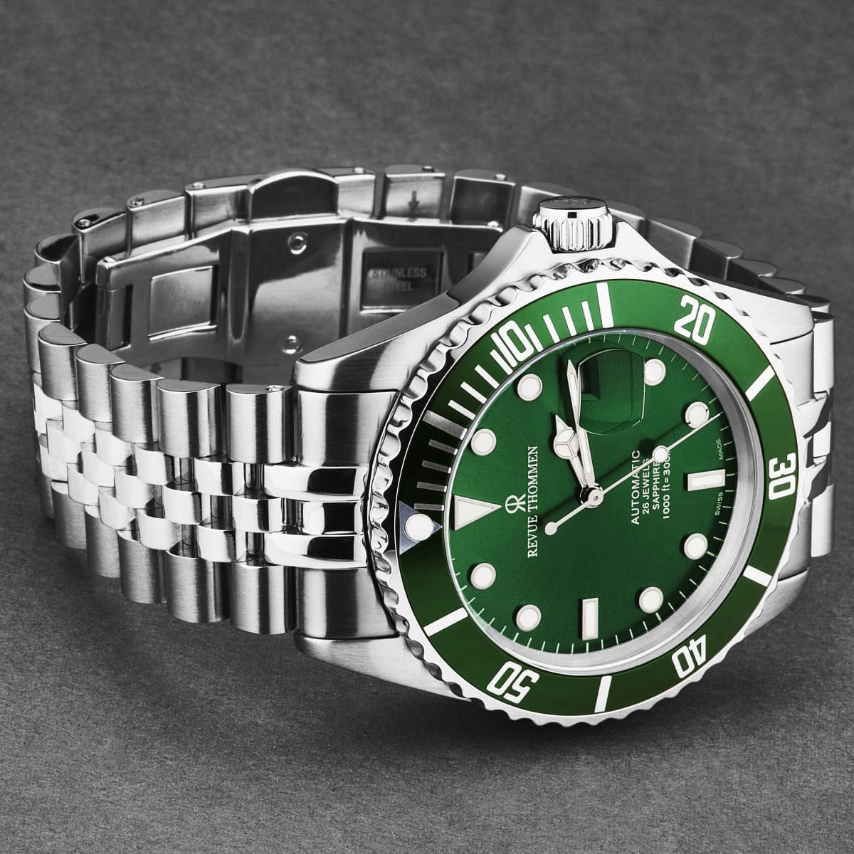 A Revue Thommen Men's 'Diver' Black Dial Stainless Steel Bracelet Automatic Watch 17571.2234 with a green dial.