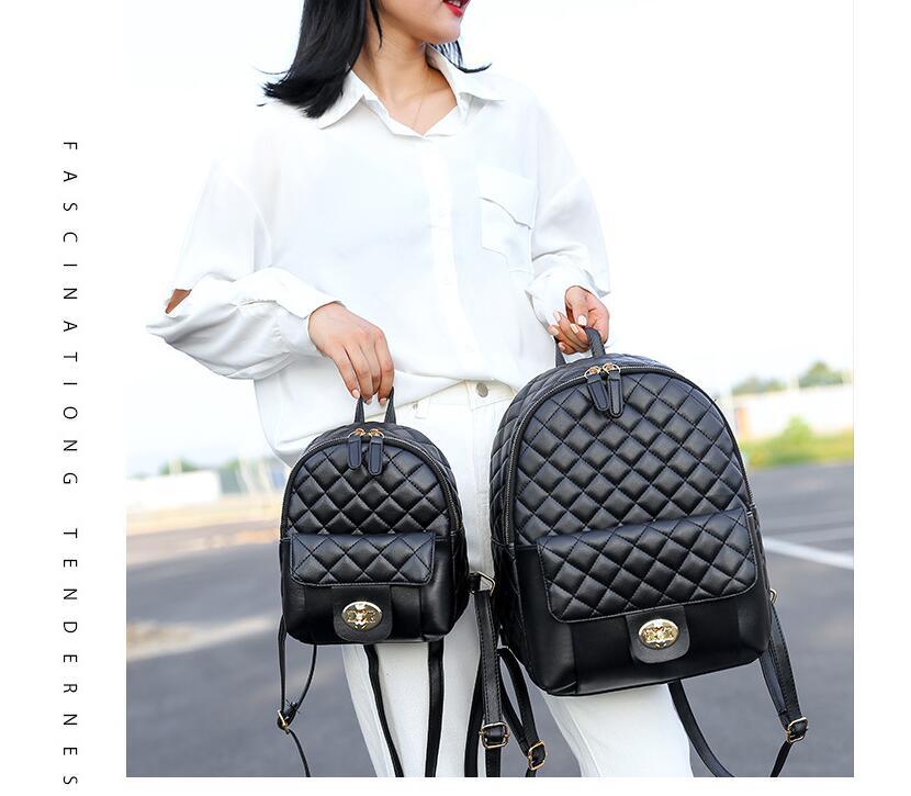 A Doba black leather backpack for men women school college bookbag for student on a white background.