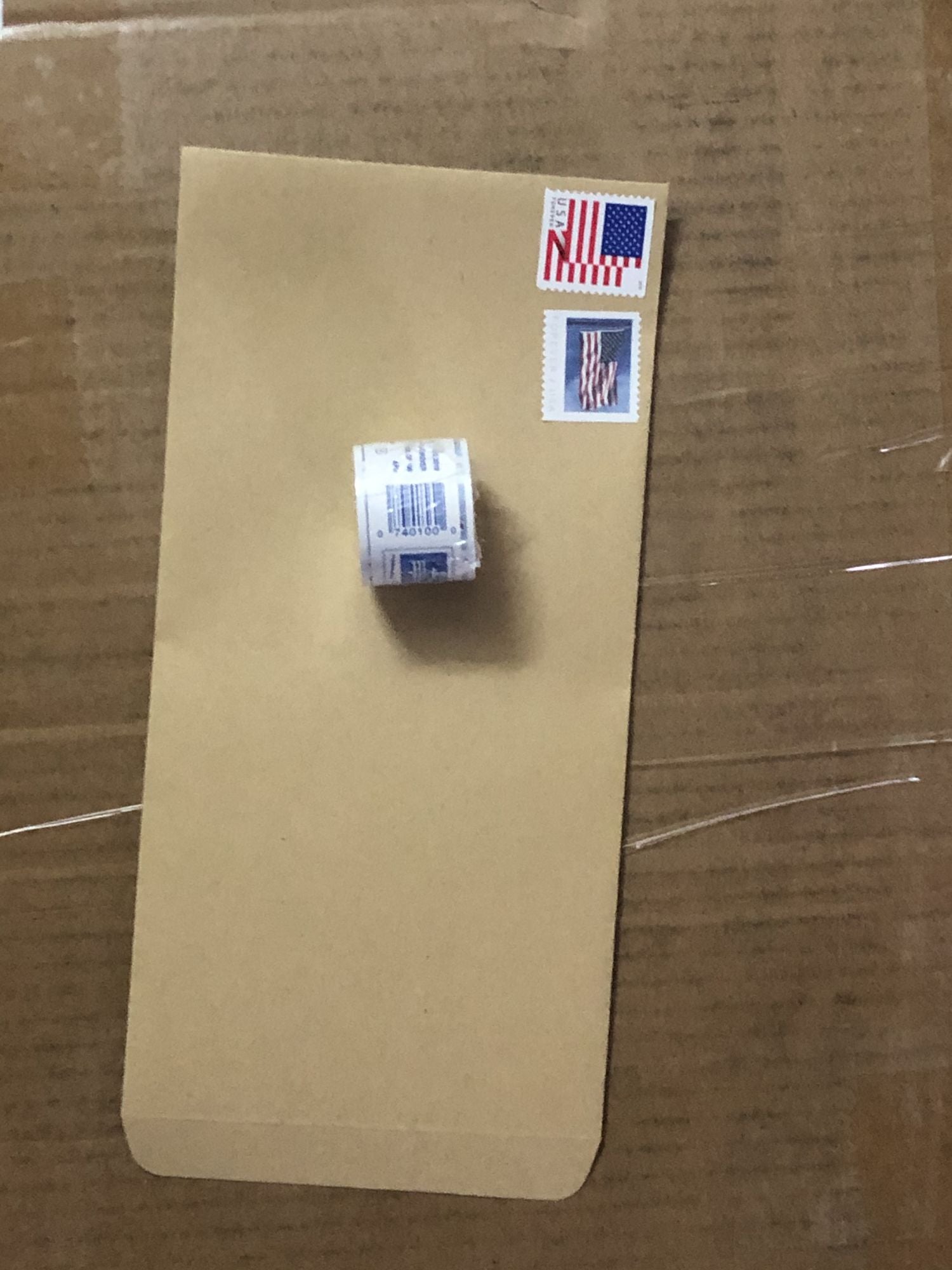 A U.S. Flag 2019; 100Pcs/1 Rolls sitting on top of a wooden table.