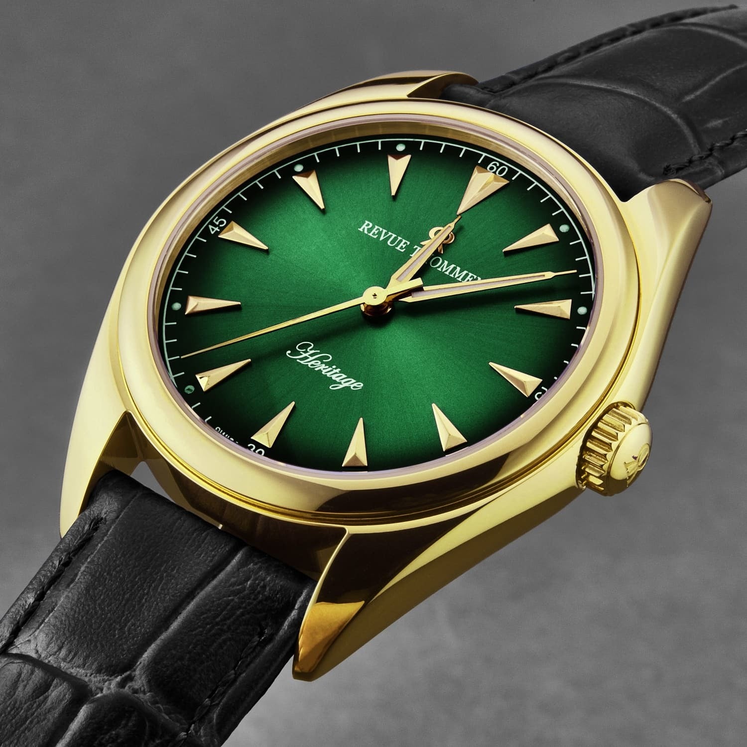 Revue Thommen Men's 'Heritage' Green Dial Black Leather Strap Automatic Watch 21010.2514 features a green dial, gold-toned case, and black leather strap. The dial displays gold hour markers and hands, with "Revue Thommen" and "Heritage" written on it.