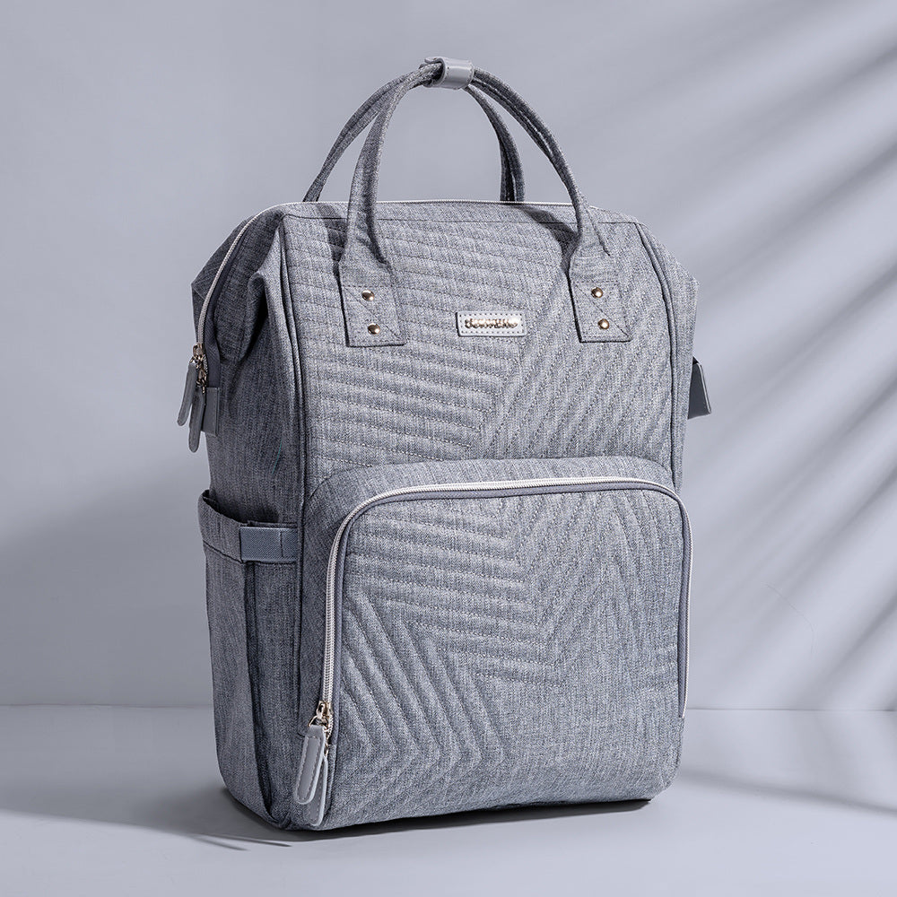 The Sunveno Fashion Diaper Bag Backpack Quilted Large Mum Maternity Nursing Bag Travel Backpack Stroller Baby Bag Nappy Baby Care by Doba is sitting on a white surface.