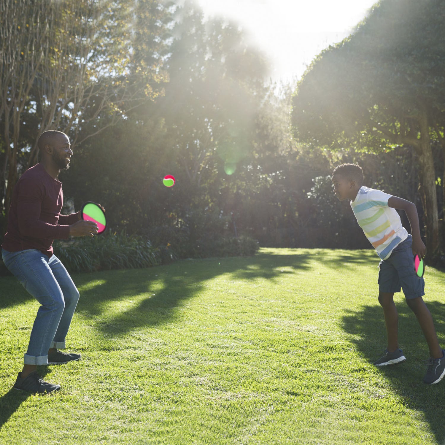 A set of 3Sets Toss and Catch Ball Throw Catch Ball Paddle Outdoor Ball Game Catch Game Beach Games, perfect for a fun backyard game with adjustable paddles.