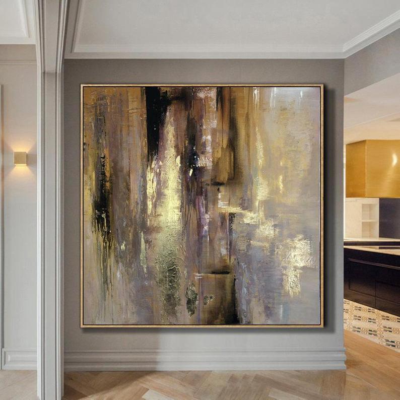 Large Original Hand Painted Abstract Modern Golden Oil Painting On Canvas Wall Art hung on a gray wall in a modern home interior with visible kitchen in the background.