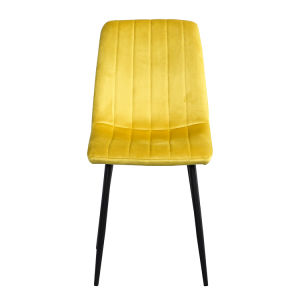 A modern dining room with a white table, four Indoor Velvet Dining Chairs with velvet fabric, and a gray rug, against a blue and white wall with minimalistic artwork.