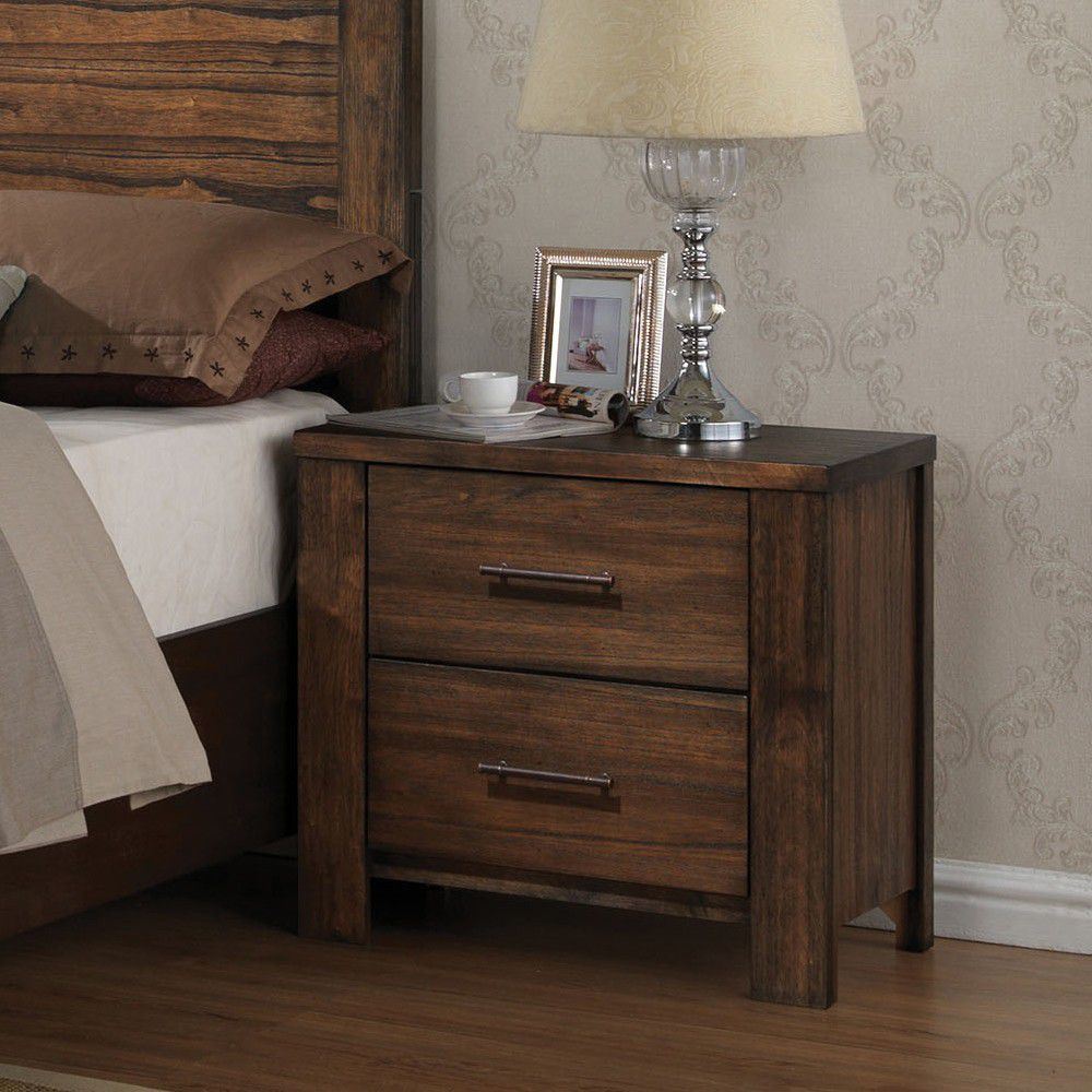 The Merrilee Nightstand in Oak YJ, featuring a beautiful oak finish, offers convenient storage with two drawers and includes a charming lamp.