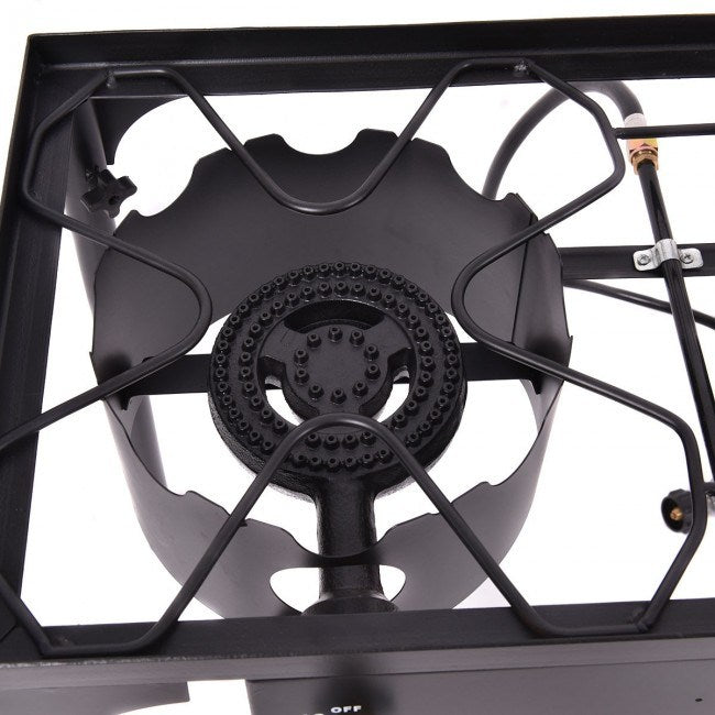 150000 BTU Double Burner Outdoor Stove BBQ Grill connected to a red propane tank, with visible blue flames on the burners, set against a white background.
