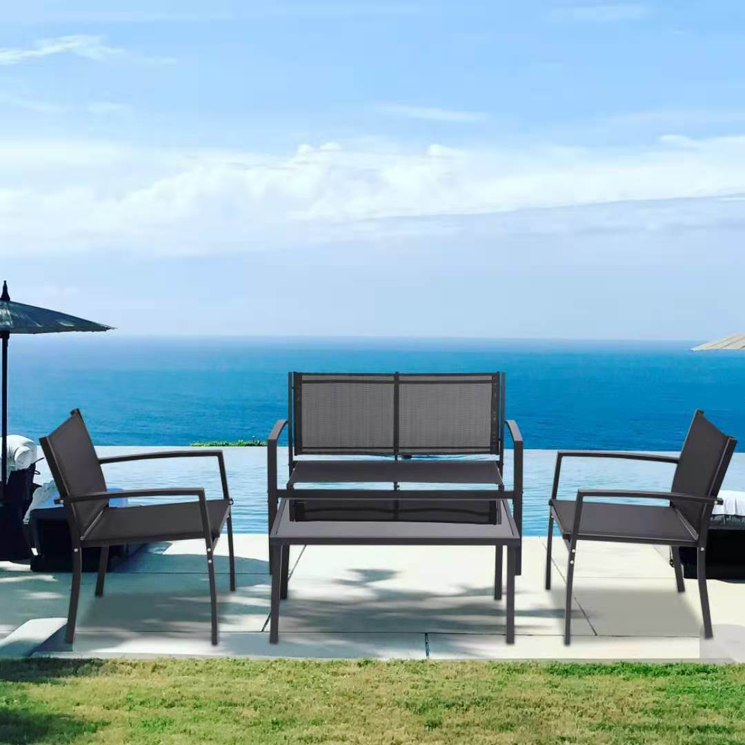 A 4 Pieces Patio Furniture Set Outdoor Garden Patio Conversation Sets Poolside Lawn Chairs with Glass Coffee Table Porch Furniture (Black) with a view of the ocean.