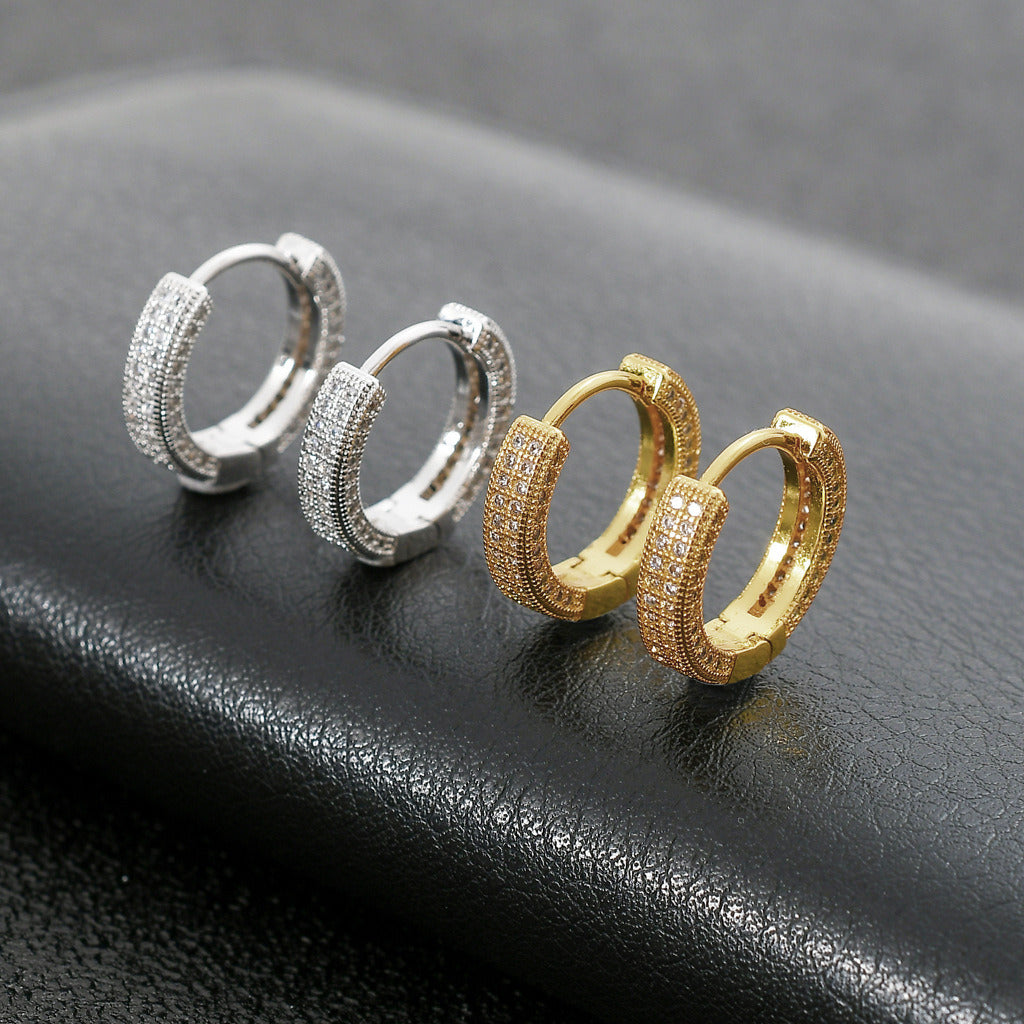 Close-up of a woman's ear wearing a Hoop Earrings Micro Encrusted Zircon Stud Earrings Bling Hip Hop Earrings For Men And Women.