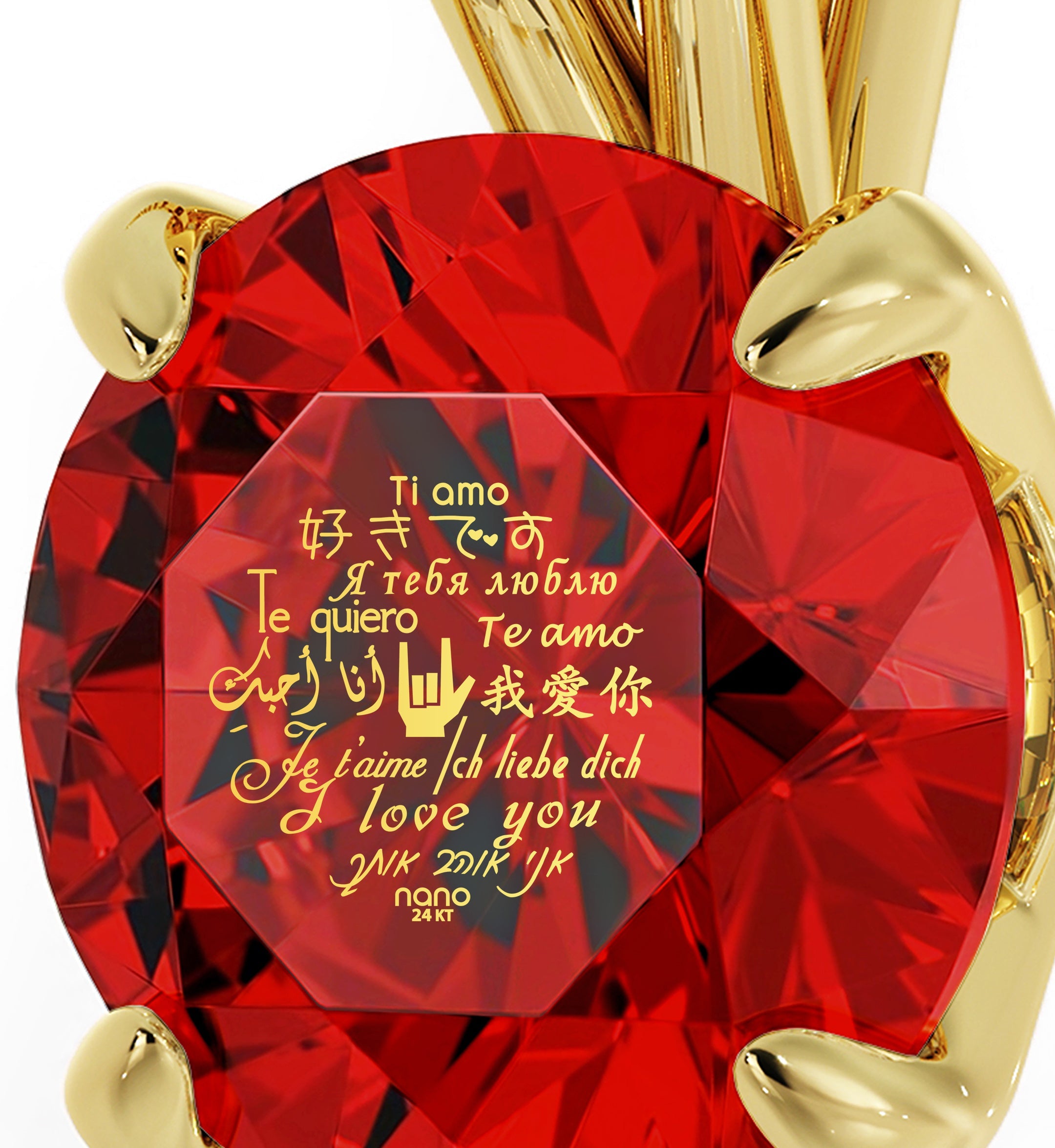 A close-up of a large Swarovski crystal held by a gold prong setting, with Gold Plated Silver I Love You Necklace Solitaire Pendant 12 Languages 24k Gold Inscribed written in multiple languages overlaying the gem.
