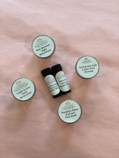 Four Organic Skin Care Trial Sets including a moisturizer, face mask, and cleansers with hyaluronic acid serum, packaged on a pink background.