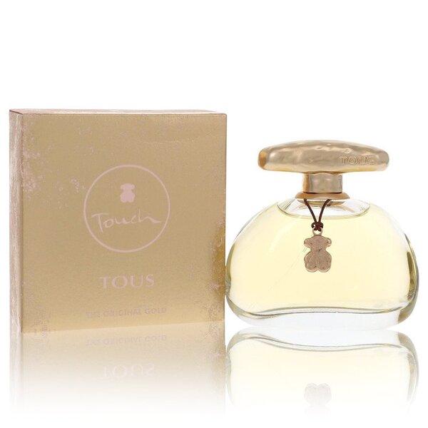 A bottle of Tous Touch Eau De Toilette Spray (new Packaging) 3.4 Oz For Women with a box next to it.