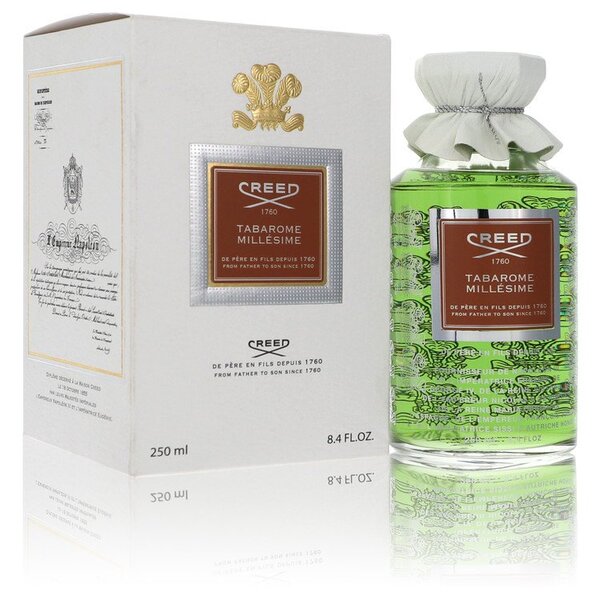 A bottle of Tabarome Millesime Spray 8.4 Oz For Men cologne in front of a box.