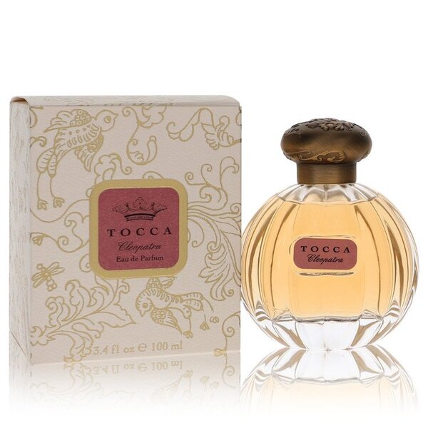 A bottle of Tocca Cleopatra Eau De Parfum Spray 3.4 Oz For Women, a fragrance known for its floral and musky accords, placed elegantly in front of a box.