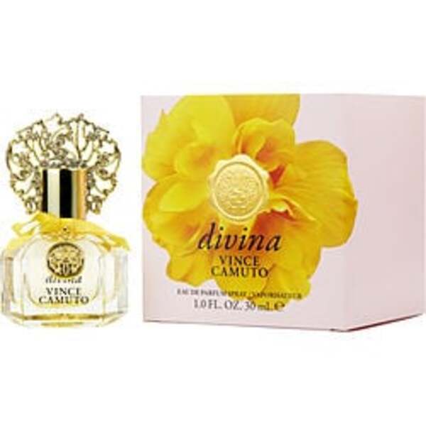 A bottle of Vince Camuto Divina By Vince Camuto Eau De Parfum spray in front of a yellow flower.
