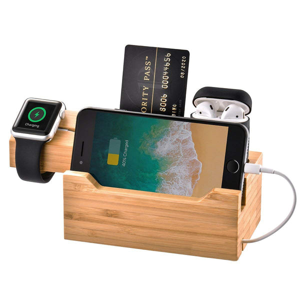 A Trexonic 3 in 1 Bamboo Charging Station with Card Holder with an Apple Watch.