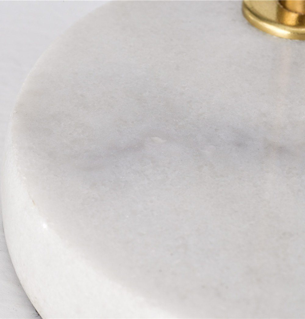 An Oda Marble Table Lamp with a marble base, manufactured by ModernMazing.