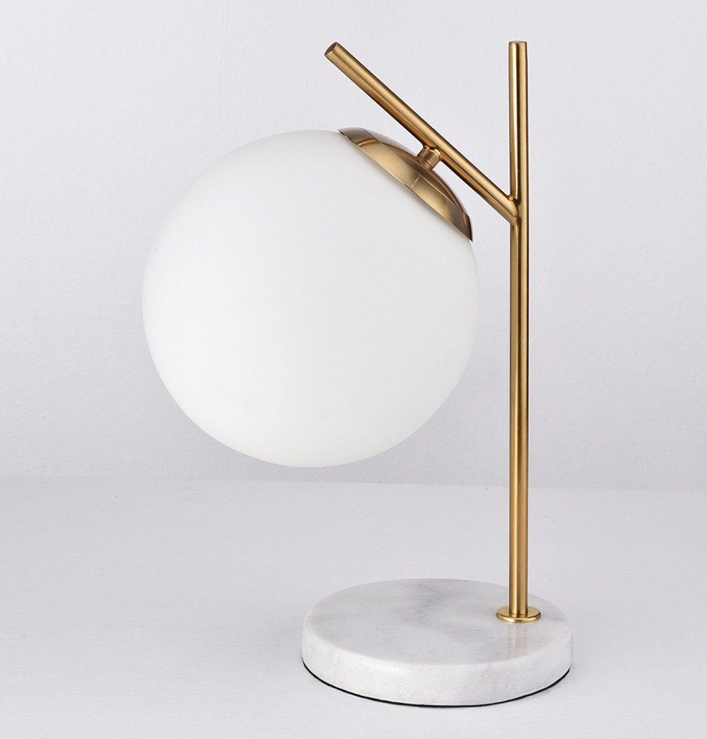 An Oda Marble Table Lamp with a marble base, manufactured by ModernMazing.