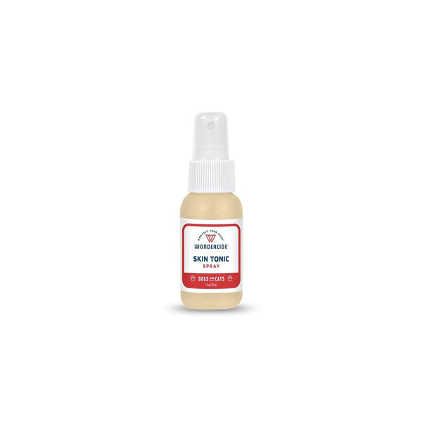 A bottle of WC DC SKN TONIC ITCH SPR 1OZ facial moisturizer on a white background.
