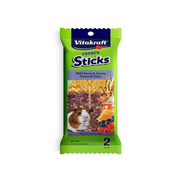 A guinea pig with a Vitakraft Crunch Sticks Wild Berry & Honey Flavored Glaze Treat for Guinea Pig 3.75 oz 2 Count on a white background.
