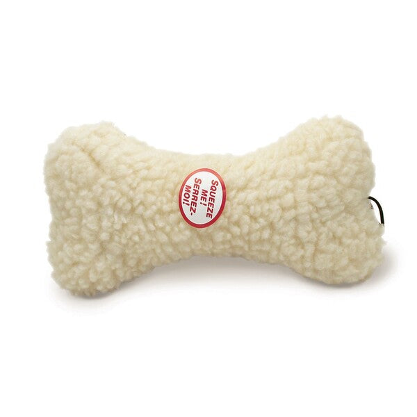 A Spot Fleece Dog Toy Bone Natural 9 in with a red label on it.
