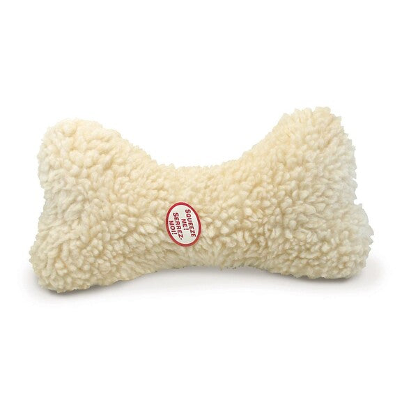 A Spot Fleece Dog Toy Bone Natural 12 in with a red tag on it.