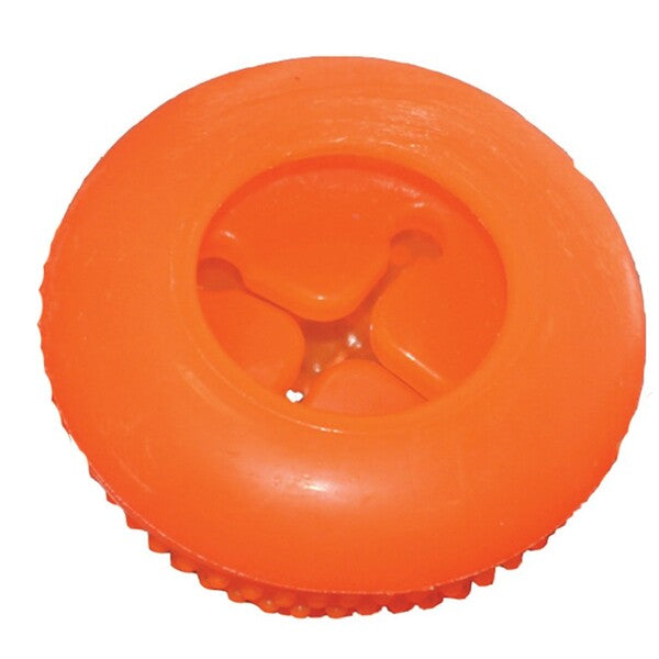 A Starmark Bento Ball Dog Toy Orange with a hole in it.