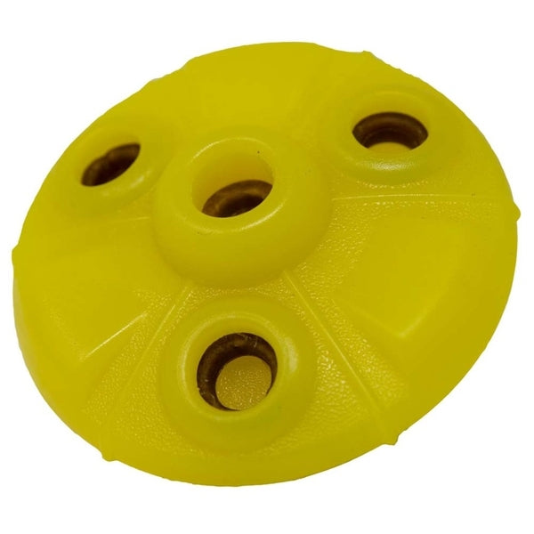 A Starmark Flex Grip Treat Ringer UFO Yellow with holes on it.