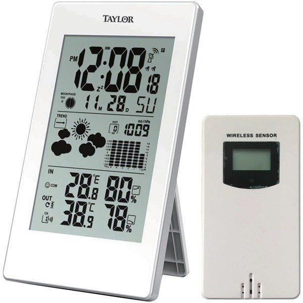 A Taylor Precision Products 1735 Digital Weather Forecaster with Barometer & Alarm Clock with a remote control.