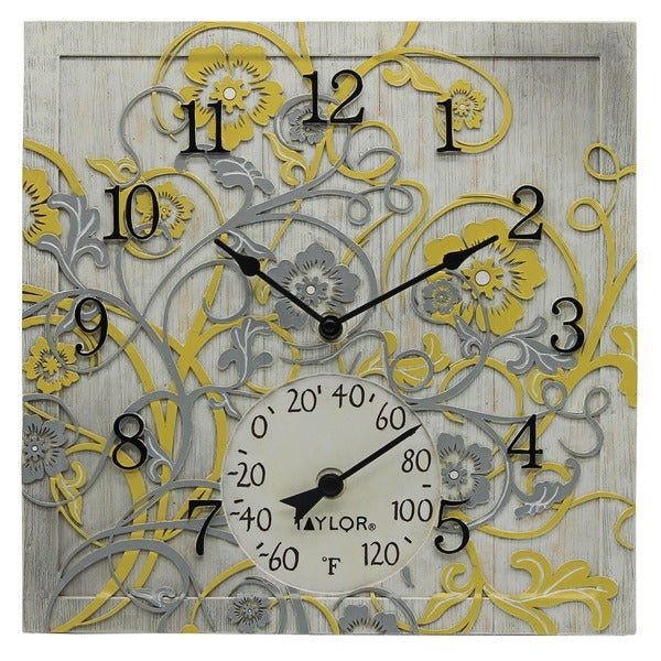 A yellow and gray Taylor Precision Products 92692T 14-In. x 14-In. Clock with Thermometer (Beachwood) with floral designs.