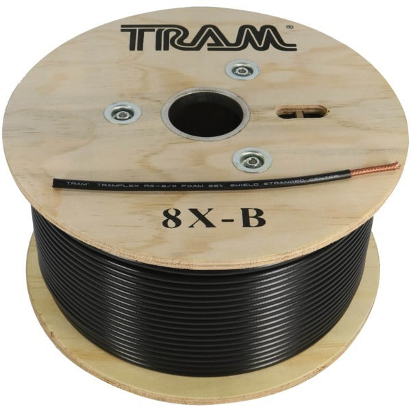 A Tram 8X-B RG8X Tramflex Precision RF Coax Cable spool on a wooden board.
