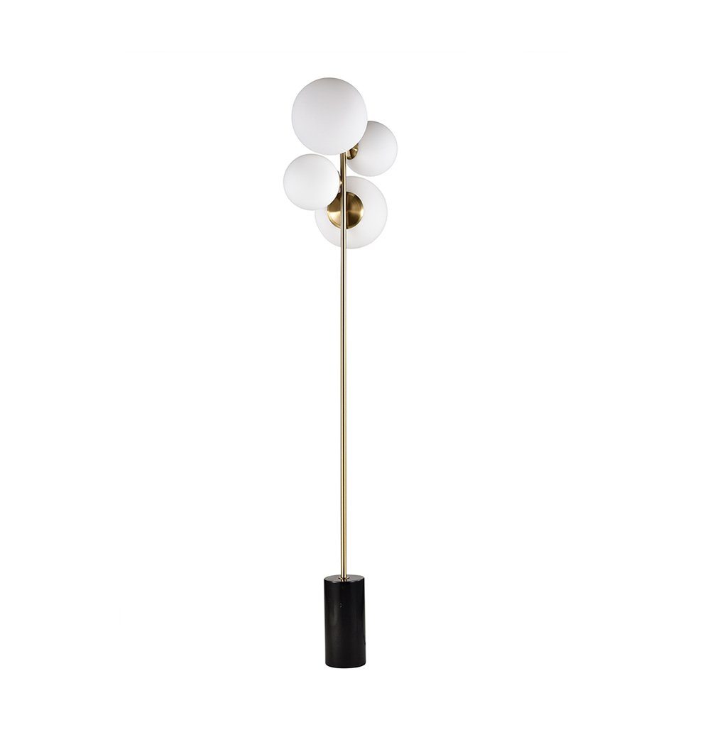 A Soili Marble Floor Lamp by ModernMazing with three spheres and a gold base.