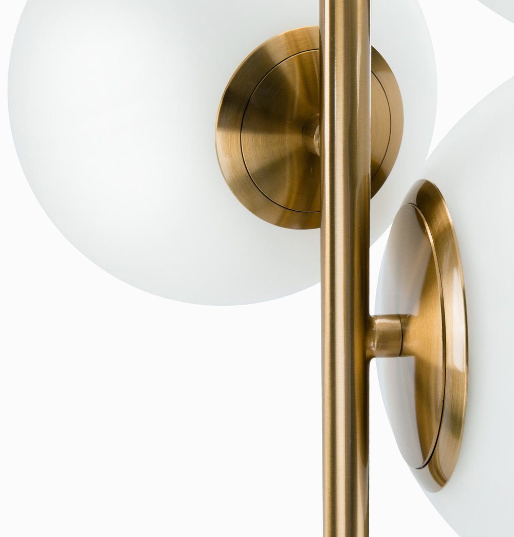 A Soili Marble Floor Lamp by ModernMazing with three spheres and a gold base.