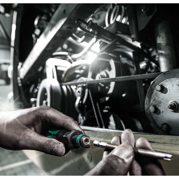 A green and black Wera Bitholding Screwdriver Handle with Rapidaptor Quick-Release Chuck.