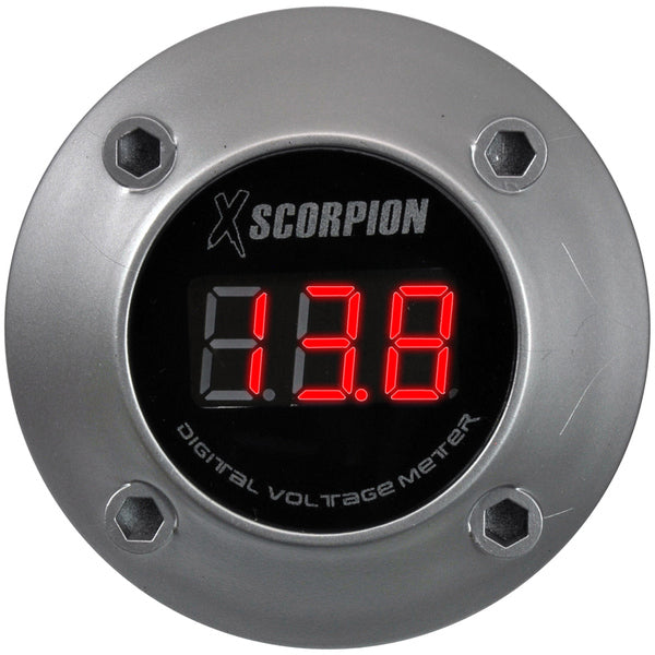 A XScorpion digital voltmeter with a black face, mounted flush on a silver aluminum finish housing.