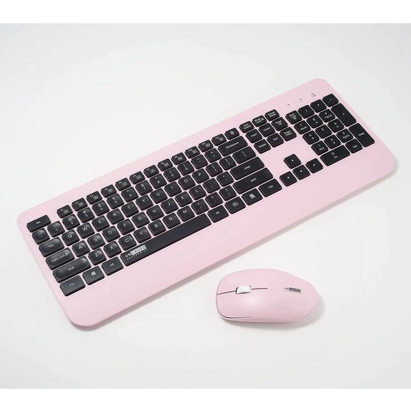 A Uncaged Ergonomics KM1 wireless keyboard and mouse combo pink on a white surface.