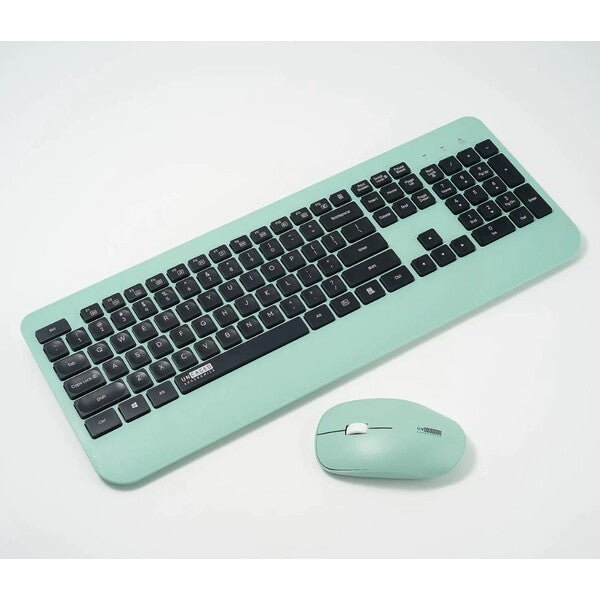An Uncaged Ergonomics KM1 Wireless Keyboard and Mouse Combo Mint Green on a white surface.
